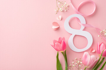 For Women's Day: An top view showcasing a number 8, a voluminous bouquet of tulips and gypsophila, a ribbon, and hearts, presented on a pastel pink background with a spot for text