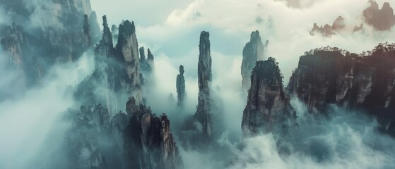 The otherworldly landscapes of Wulingyuan Scenic Area, China, where towering sandstone pillars pierce the mist-filled valleys below