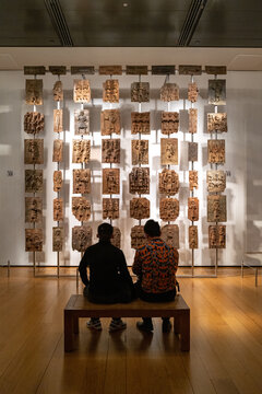 : The Benin bronzes ,Africa Gallery of the British Museum, admired by tourists. Taken from the Royal Palace of Benin, now Nigeria, with some dating back to the 13th century