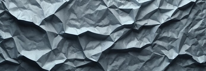 Texture of crumpled kraft paper in trendy gray color for background. Panoramic view, texture for...