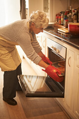 Senior woman, oven and cooking pie at home in kitchen for food, nutrition and dessert. Female...