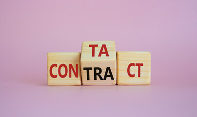 Contact and Contract symbol. Wooden cubes with words Contract and Contact. Beautiful pink background. Contact and Contract and business concept. Copy space