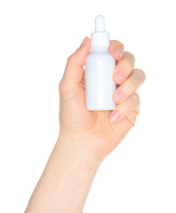 Woman hand holding a white cosmetic bottle, isolated on white background close-up, template for cosmetics ads