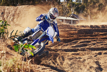 Person, dirt bike and professional motorcyclist in extreme sports, competition or race on outdoor...