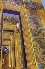Modern multi deck story atrium, foyer or lobby with elevators and staircase onboard cruiseship...
