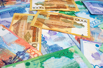 Closeup multicolored paper banknotes of Republic of Kazakhstan. Cash money to pay, credit, debt,...