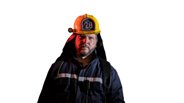 portrait of a male firefighter with a smoky face