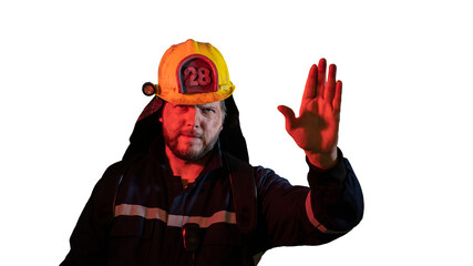 the male firefighter shows a hand gesture attention carefully