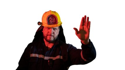 the male firefighter shows a hand gesture attention carefully