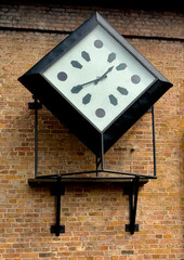 Black clock with white face and black hour markings