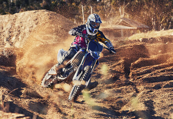 Person, dirt track and professional motorcyclist on bike for extreme sports, competition or outdoor...