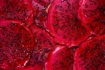 Red dragon fruit Set with appetizing serving on green background. Top view