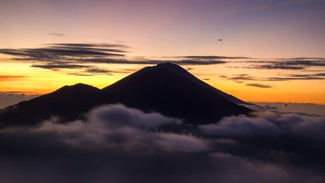 Time-lapse of a sunrise over Mount Agung seen from Mount Batur, Bali, Indonesia