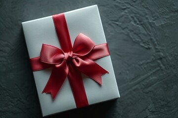 Experience the essence of simplicity, style, and elegance in a minimalist context with a blank white gift card adorned with a classic red ribbon bow