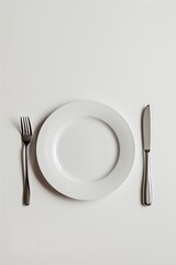 White Plate with Cutlery on Minimalist Background