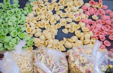 Close up on fresh raw orecchiette, typical apulian pasta, in downtown in Bari, Puglia region, southern Italy