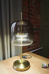 An interesting designer lamp on a golden base with thick glass. English style. Classic interior - 743938235