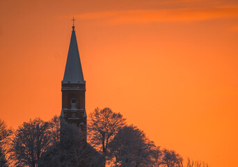 sunrise over the church tower - obrazy, fototapety, plakaty