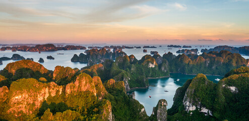 Aerial view of Ha Long Bay during sunrise and beautiful day, blue clear sky. Vietnam tourist...