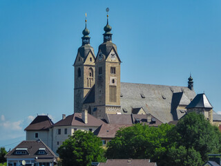 Fototapeta premium Close up view of Pilgrimage Church of the Assumption of Mary in town of Maria Saal, Carinthia, Austria. Idyllic hiking trail in summer on sunny day. Catholic Church. Faith and belief concept