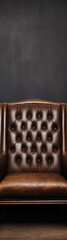 Retro Chesterfield sofa in brown leather with dark background
