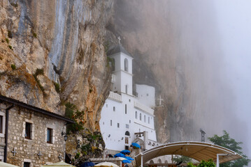 Montenegro, Ostrog - August 6, 2023. Monastery Ostrog in the mountains, a functioning Serbian Orthodox monastery, located at an altitude of about 900 m above sea level. Founded in the XVII century