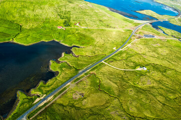 Highway road through mossy wilderness in summer at Iceland