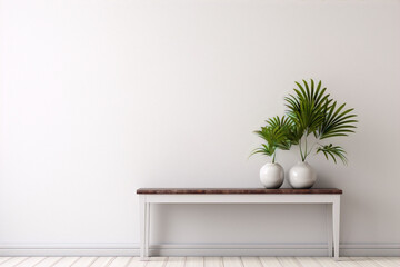 White wall with wooden table and two vases of green leaves