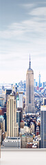 Cityscape of New York City featuring the Empire State Building in the center.