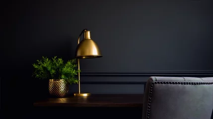 Fotobehang A golden lamp and a green plant on a wooden table with a gray chair in the background against a dark gray wall. © sakina