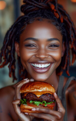 A happy beautiful young woman eats a cheese Burger - 743965650