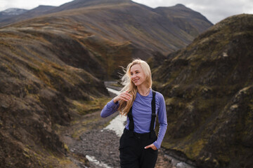 Traveling and exploring Iceland landscapes and travel destinations. Young traveler enjoying the...