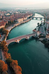 Naklejka premium An aerial perspective showing a bridge stretching across a river, connecting one side to the other. The bridge is prominent, allowing vehicles and pedestrians to traverse the water body below