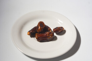 Pile of delicious dried dates isolated on white background. Arabic food