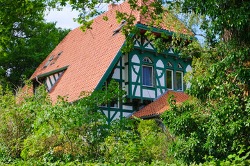 traditional german rural cottage facade and roof in the woods