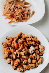 Delicious shrimp and mussels. Seafood on a white plate