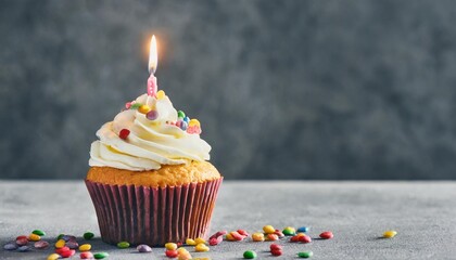 tasty birthday cupcake with candle on grey background