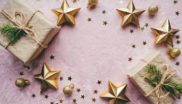 frame from wrapped boxes with presents and golden decorative stars on pink paper textured background place for text flat lay holiday layout