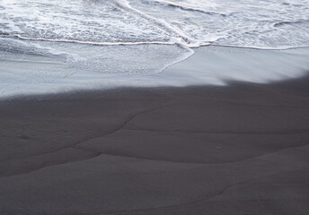 beach with black volcanic sand on  Tenerife