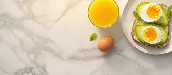 breakfast with avocado toast orange juice and boiled egg top view. with copy space image. Place for adding text or design