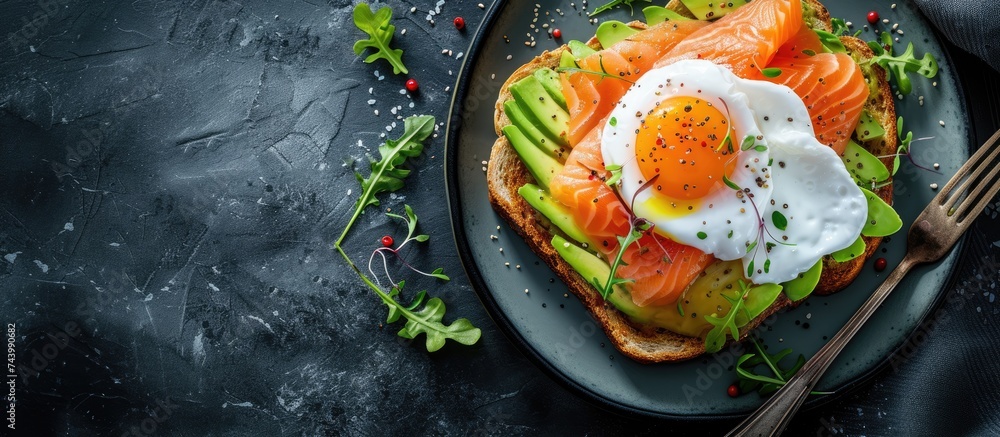 Aufkleber Toast with salmon poached egg and avocado on a white plate Poached egg with salmon and guacamole on rye bread. with copy space image. Place for adding text or design