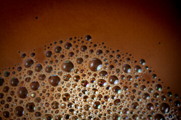 Close up view of foam on surface of coffee