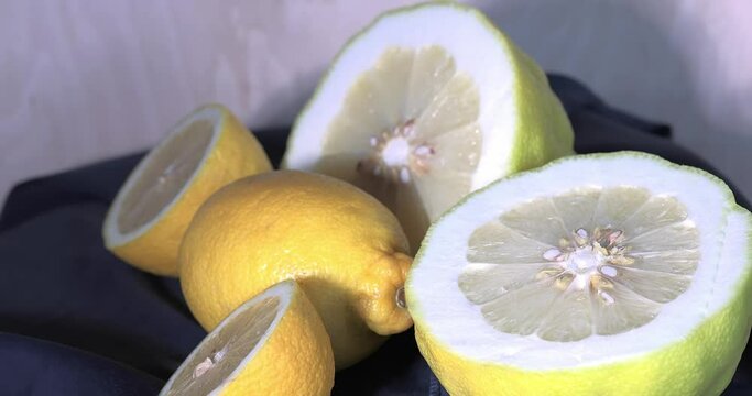 A fresh giant yellow lemon on a rotating table. The weight of a lime is 1 kg