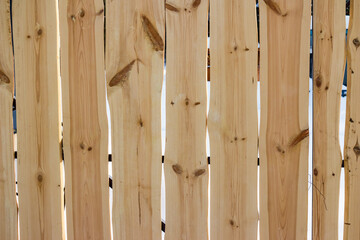 Wooden fence made from fresh boards