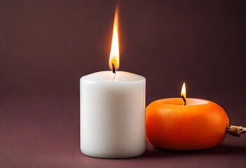 Fototapeta na wymiar White paraffin candle with a flame burning