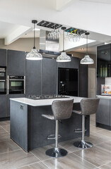 Beautiful grey slate and marble European style modern home kitchen. Elegant minimal home interior...