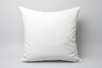 White pillow on gray background, suitable for home decor themes