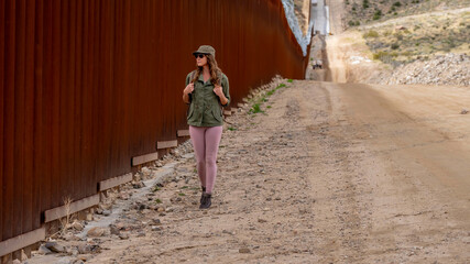 Desperate Journey: Migrant Navigates Jacumba's Border Wall in Search of Entry into the United States