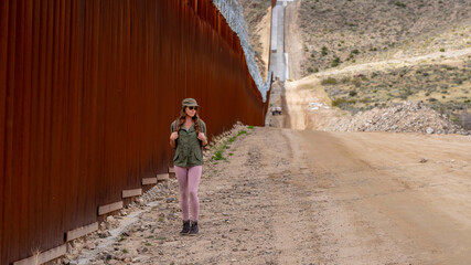 Desperate Journey: Migrant Navigates Jacumba's Border Wall in Search of Entry into the United States