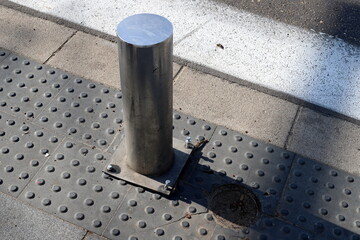Pillars along the road for the safe passage of pedestrians.